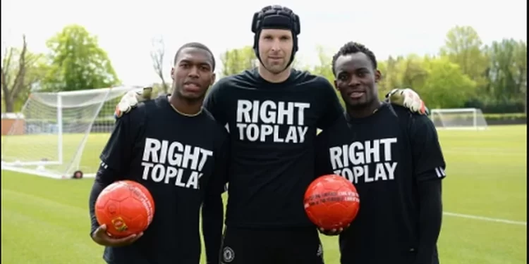 Daniel Sturridge congratulates Michael Essien on obtaining a UEFA A coaching license.